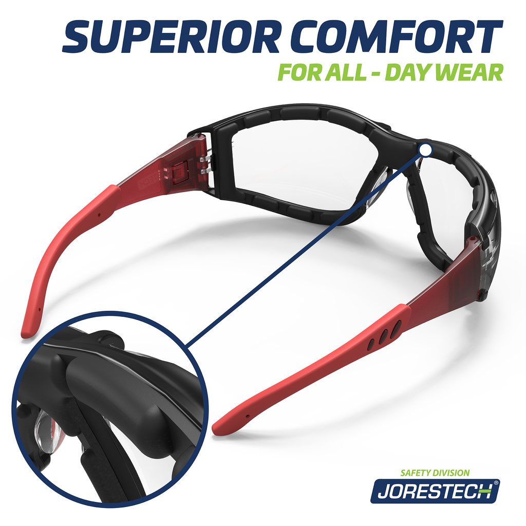 Image shows a view of the back of the red and clear JORESTECH anti fog safety glasses convertibles to goggles with removable temples and elastic headband. Close up of the foam gasket is shown in a circle and text reads superior comfort for all day wear.