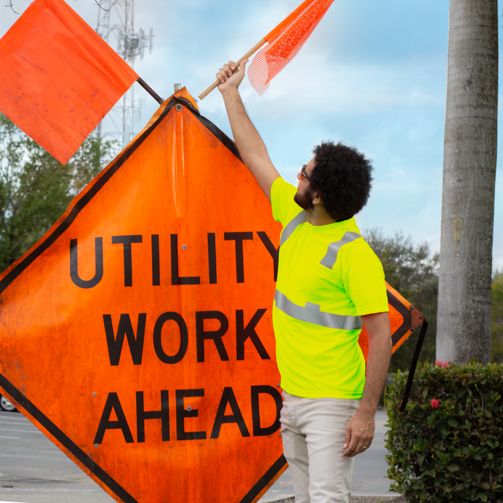 A road worker wearing the jorestech reflective safety pocket shirt for protection