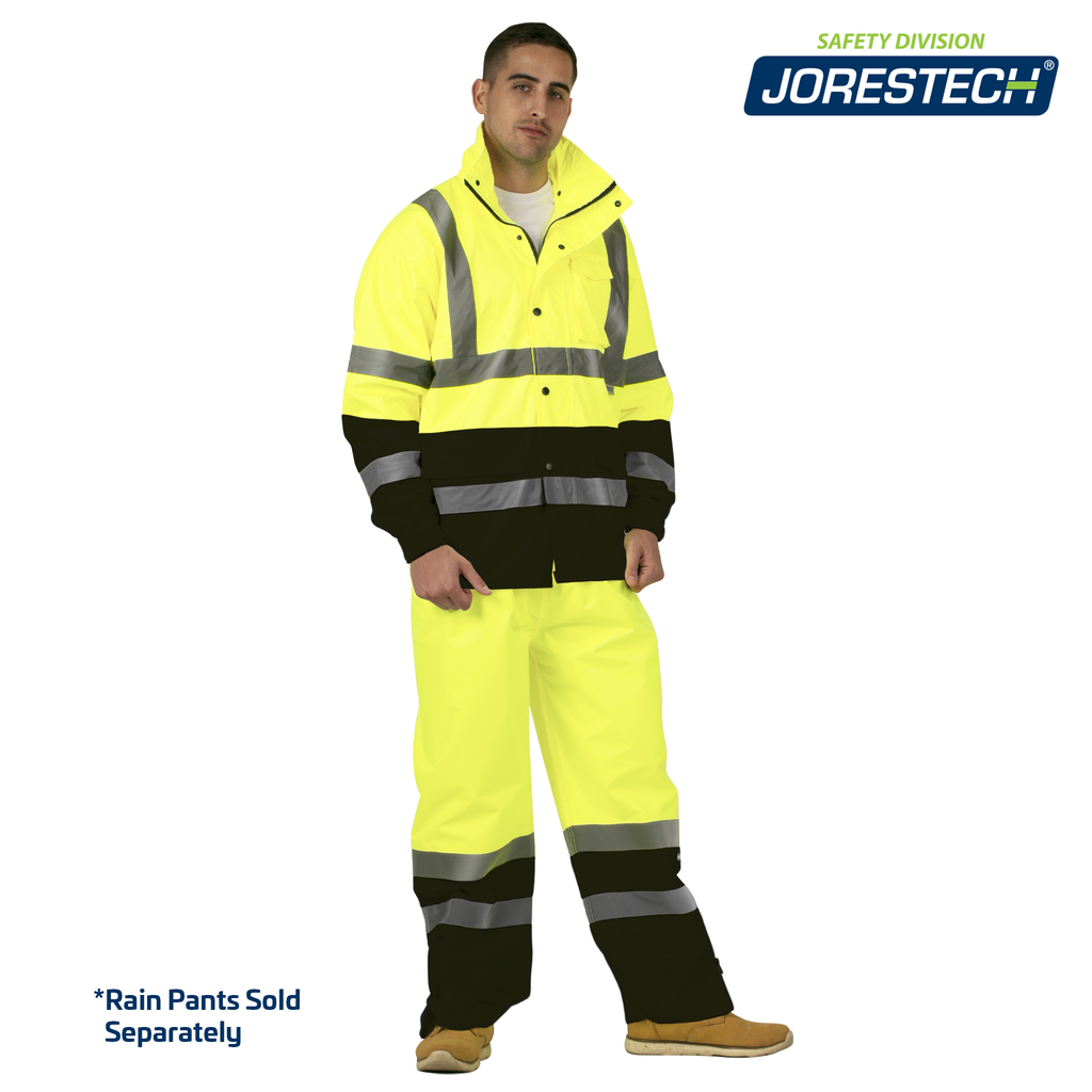 Man wearing the yellow and black high visibility rain jacket and pants. Theres blue text that reads "rain pants sold separately"