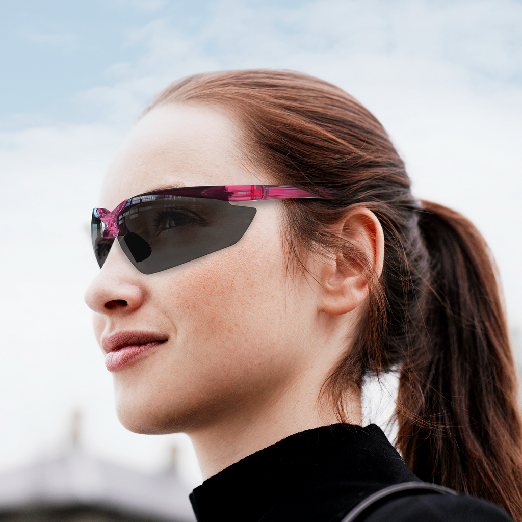 woman wearing the hi impact wrap around pink safety sun glasses for outdoor sports